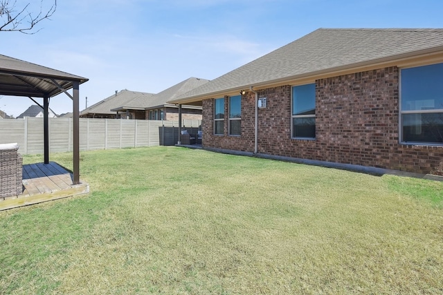 view of yard featuring a gazebo and fence