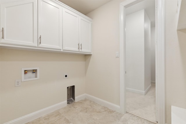 washroom featuring washer hookup, cabinet space, baseboards, and hookup for an electric dryer