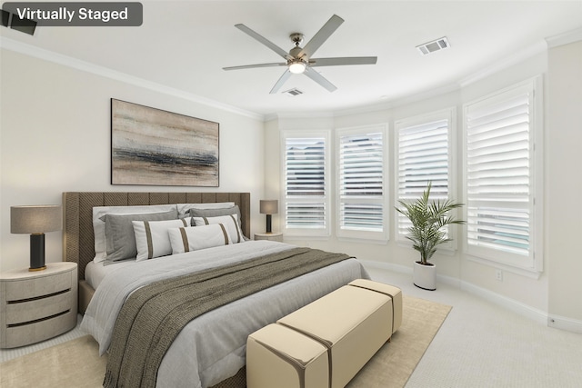 carpeted bedroom featuring multiple windows, baseboards, visible vents, and ornamental molding