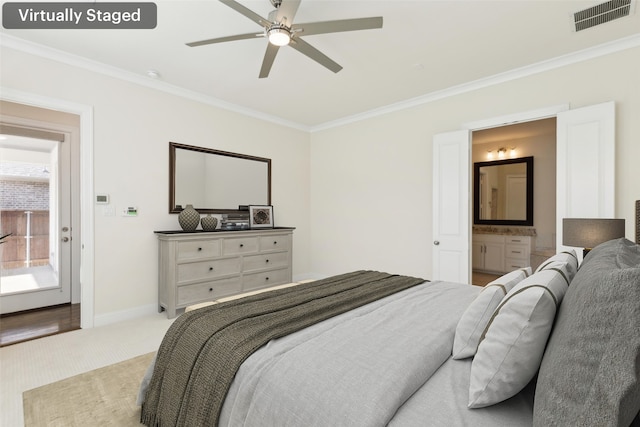 carpeted bedroom with visible vents, crown molding, and baseboards