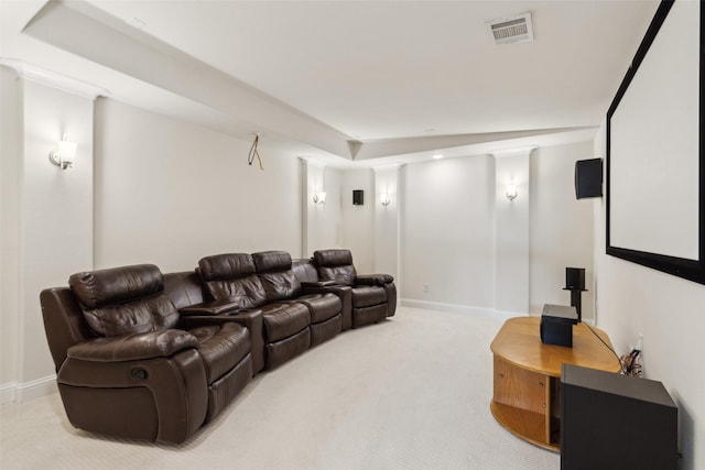 home theater room featuring light carpet, visible vents, and baseboards