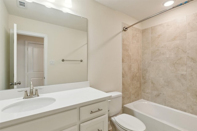 bathroom with visible vents, toilet, vanity, and washtub / shower combination