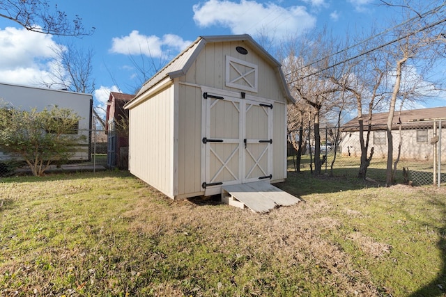 view of shed with fence