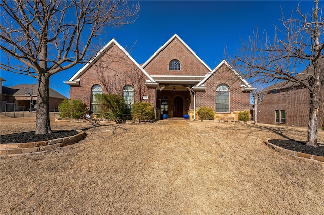 view of front of property featuring brick siding