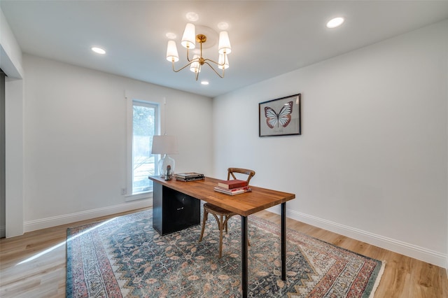 office area featuring light wood-style flooring, recessed lighting, baseboards, and a chandelier