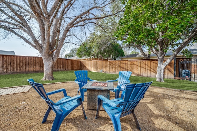 view of yard with a patio, a fire pit, and a fenced backyard