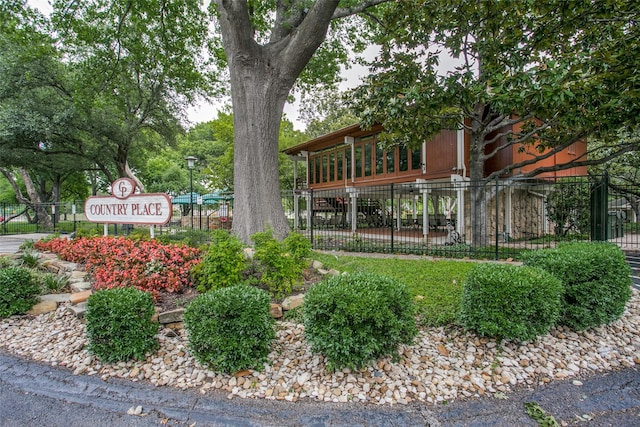 view of home's community with fence