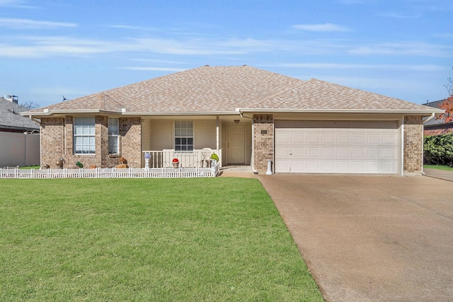 ranch-style home featuring a garage, roof with shingles, a front yard, and fence