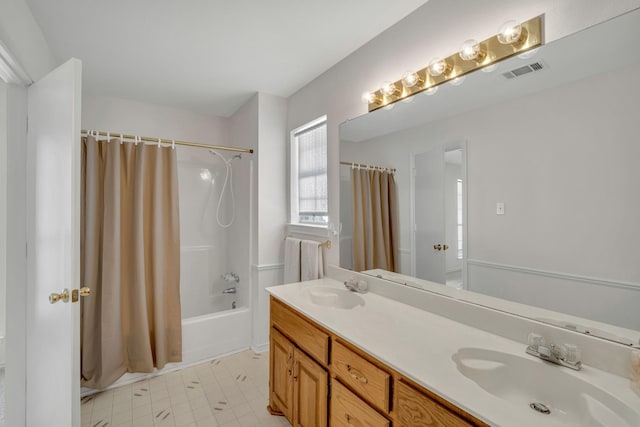 full bath with double vanity, shower / bath combination with curtain, visible vents, and a sink