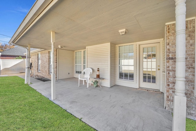 view of patio / terrace featuring fence