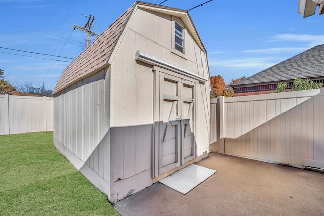 view of shed with a fenced backyard