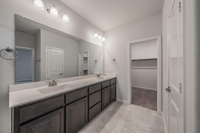 2420 Red Draw Rd, Fort Worth, TX 76177 - bathroom featuring a sink, a walk in closet, double vanity, and visible vents