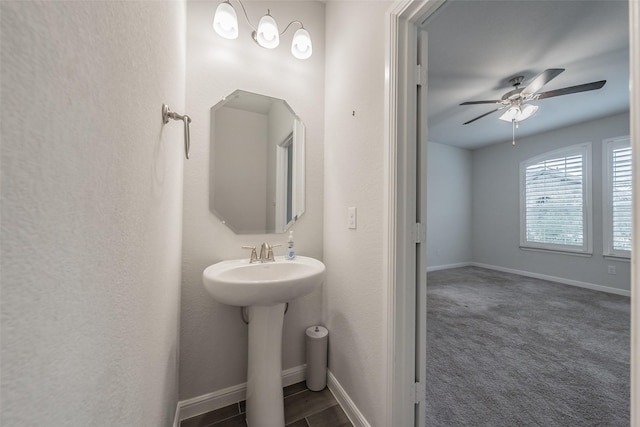 2420 Red Draw Rd, Fort Worth, TX 76177 - bathroom with baseboards, a ceiling fan, and a sink