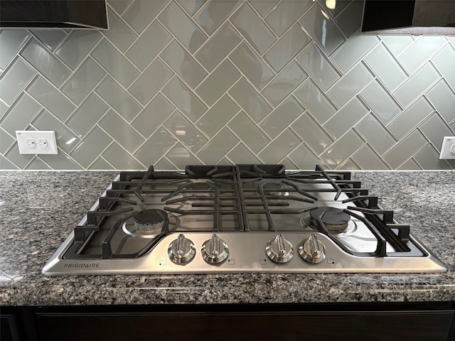 2420 Red Draw Rd, Fort Worth, TX 76177 - interior details with stainless steel gas cooktop, backsplash, and dark stone countertops