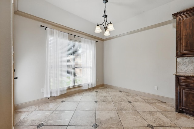 unfurnished dining area with crown molding, light tile patterned floors, baseboards, and a chandelier