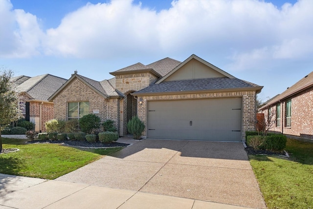 french provincial home with brick siding, concrete driveway, an attached garage, and a shingled roof