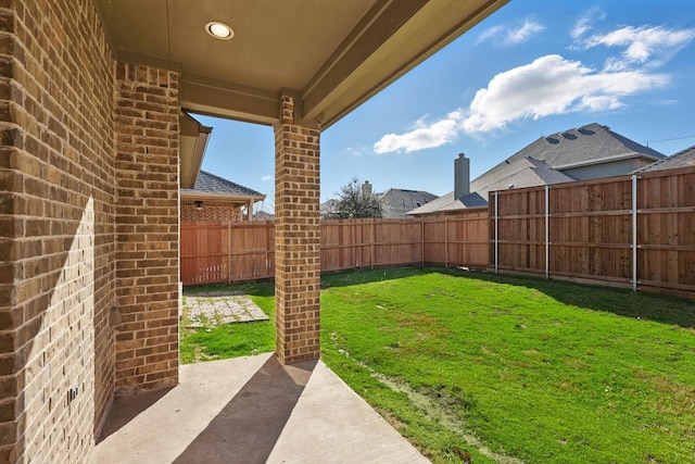 view of yard featuring a patio and a fenced backyard