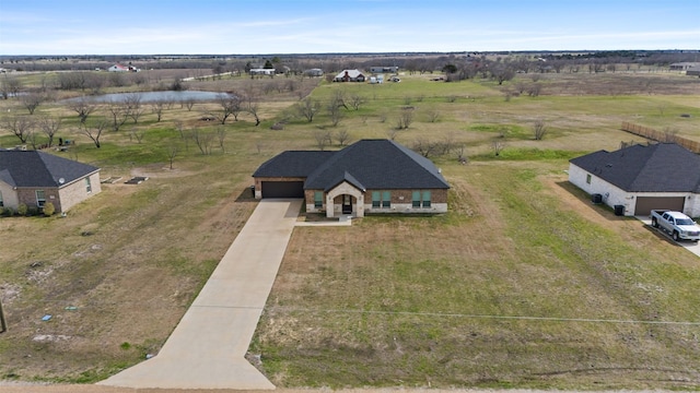 bird's eye view with a rural view and a water view