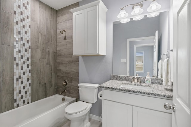 bathroom with bathing tub / shower combination, baseboards, toilet, and vanity