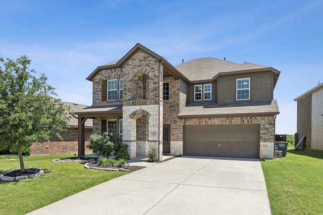 view of front of house featuring brick siding, a front yard, a garage, stone siding, and driveway