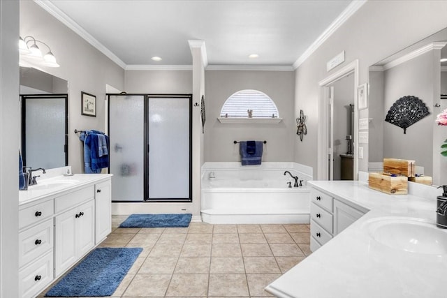 bathroom featuring a sink, two vanities, a stall shower, and tile patterned floors