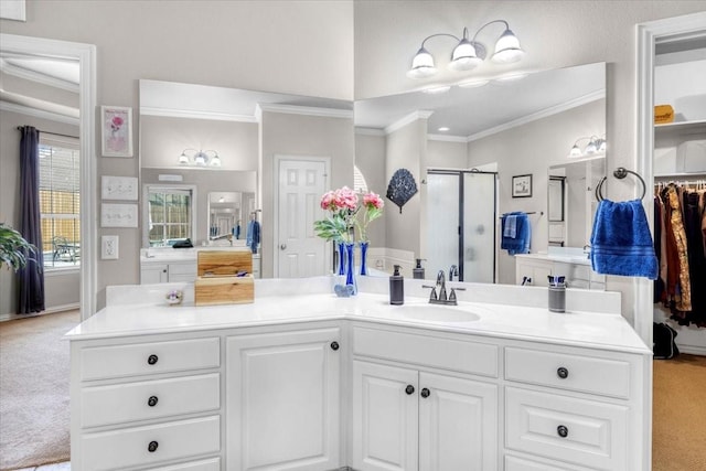 full bath featuring a shower stall, vanity, and ornamental molding