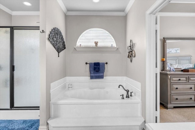 bathroom featuring recessed lighting, a shower stall, a garden tub, and ornamental molding