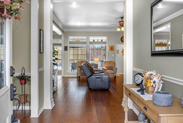 interior space featuring ceiling fan, dark wood-style floors, baseboards, and ornamental molding