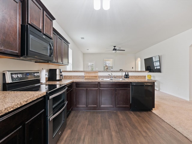 14157 Stallion Ridge Dr, Dallas, TX 75253 - kitchen with black appliances, a sink, dark brown cabinetry, a peninsula, and light countertops