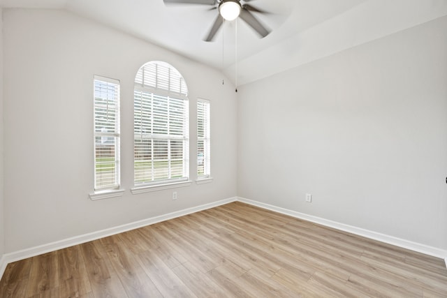 unfurnished room featuring a ceiling fan, light wood-style floors, baseboards, and a wealth of natural light