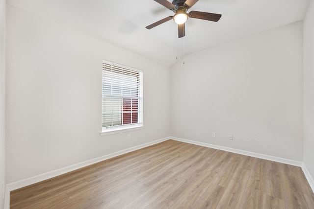 unfurnished room with light wood finished floors, a ceiling fan, and baseboards