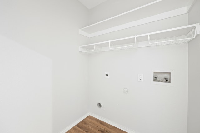 laundry room featuring electric dryer hookup, laundry area, baseboards, hookup for a washing machine, and dark wood-style flooring