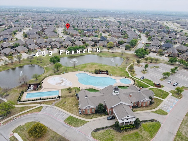 aerial view with a residential view and a water view