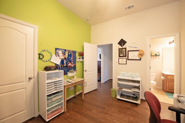 office space featuring dark wood finished floors and visible vents