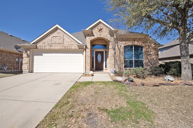 single story home featuring an attached garage, brick siding, and concrete driveway