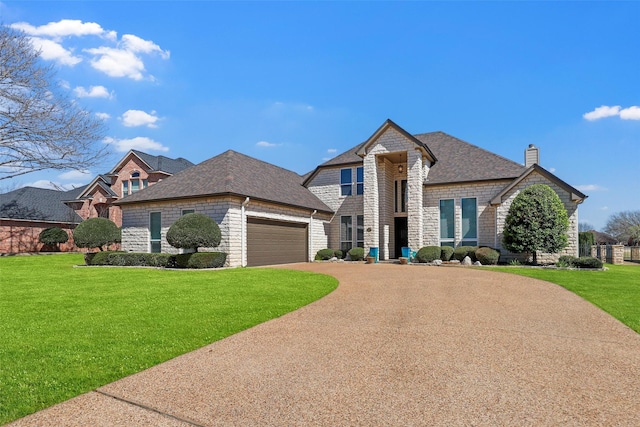 french provincial home with a garage, a front lawn, a chimney, and driveway