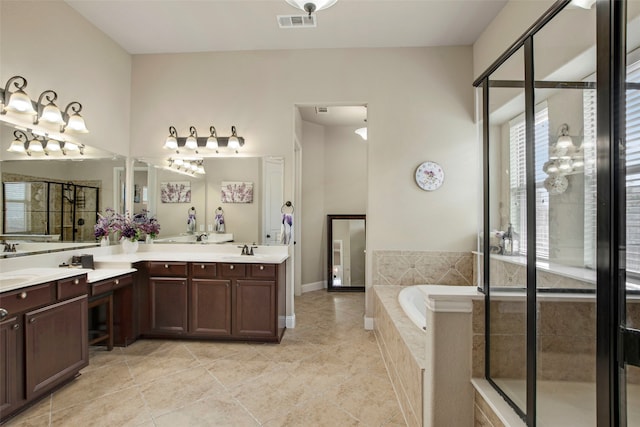 full bath featuring visible vents, a stall shower, vanity, and a garden tub