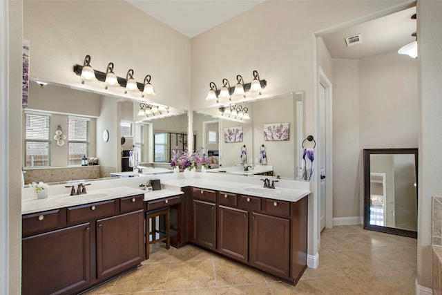 full bathroom featuring visible vents, vanity, and baseboards