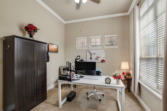 office with baseboards, light colored carpet, ceiling fan, and crown molding