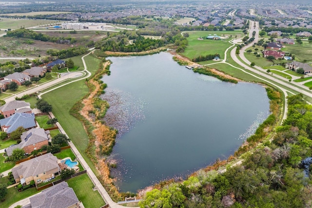 aerial view with a water view and a residential view