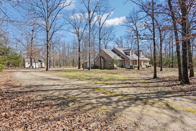 view of side of home with a yard