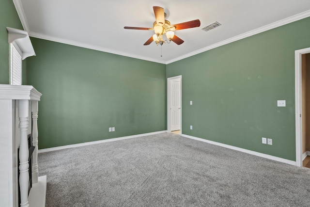 interior space featuring crown molding, carpet, visible vents, and baseboards