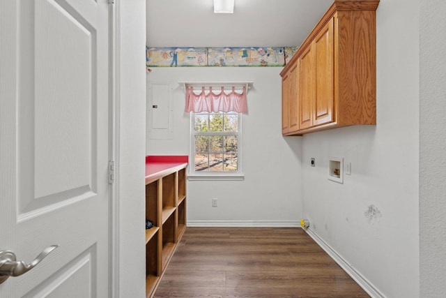 laundry room featuring cabinet space, hookup for an electric dryer, hookup for a washing machine, and baseboards