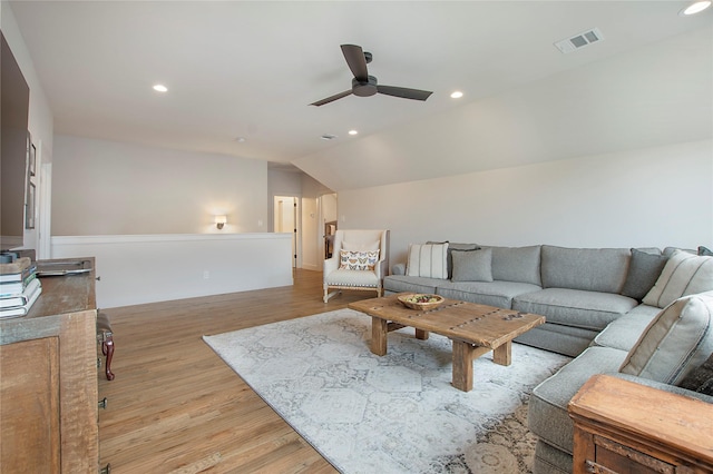 living room with visible vents, recessed lighting, ceiling fan, vaulted ceiling, and light wood-style floors