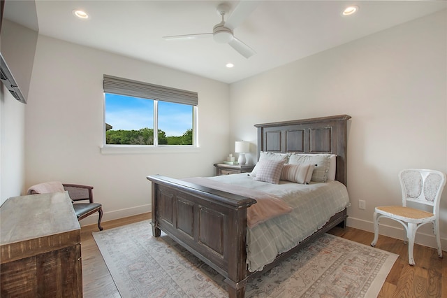 bedroom with ceiling fan, recessed lighting, baseboards, and light wood-type flooring