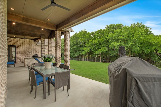 view of patio / terrace with outdoor dining space, a ceiling fan, fence, and a grill