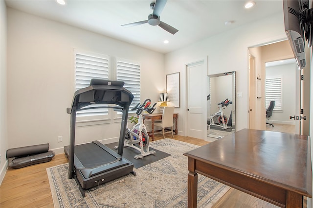 exercise room with recessed lighting, baseboards, light wood-style flooring, and ceiling fan