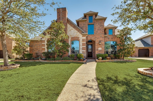 view of front of house with brick siding, stone siding, a chimney, and a front yard