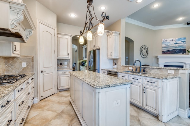 kitchen with premium range hood, a kitchen island, arched walkways, a sink, and appliances with stainless steel finishes