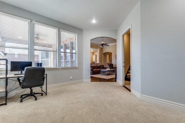 office area featuring recessed lighting, carpet, arched walkways, and baseboards